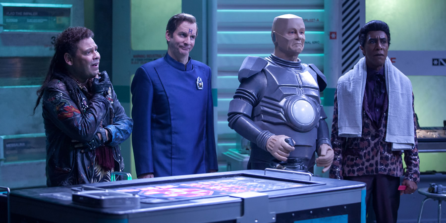 Red Dwarf. Image shows from L to R: Lister (Craig Charles), Rimmer (Chris Barrie), Kryten (Robert Llewellyn), Cat (Danny John-Jules). Red Dwarf. Image shows from L to R: Lister (Craig Charles), Rimmer (Chris Barrie), Kryten (Robert Llewellyn), Cat (Danny John-Jules).