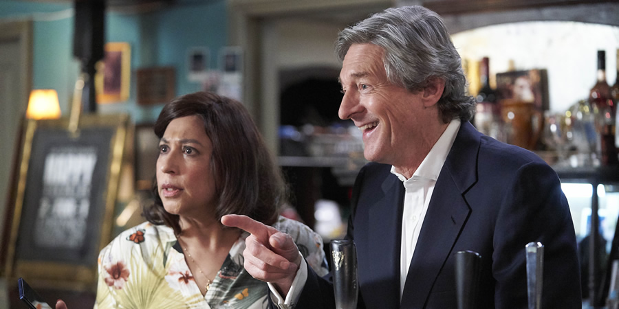 The Reluctant Landlord. Image shows from L to R: Jayanthi (Shaheen Khan), Dr Shepherd (Nigel Havers). Copyright: What Larks Productions. The Reluctant Landlord. Image shows from L to R: Jayanthi (Shaheen Khan), Dr Shepherd (Nigel Havers). Copyright: What Larks Productions.