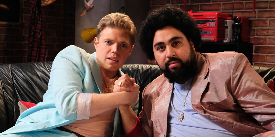 Rob Beckett's Playing For Time. Image shows from L to R: Rob Beckett, Asim Chaudhry. Copyright: Rumpus Media. Rob Beckett's Playing For Time. Image shows from L to R: Rob Beckett, Asim Chaudhry. Copyright: Rumpus Media.