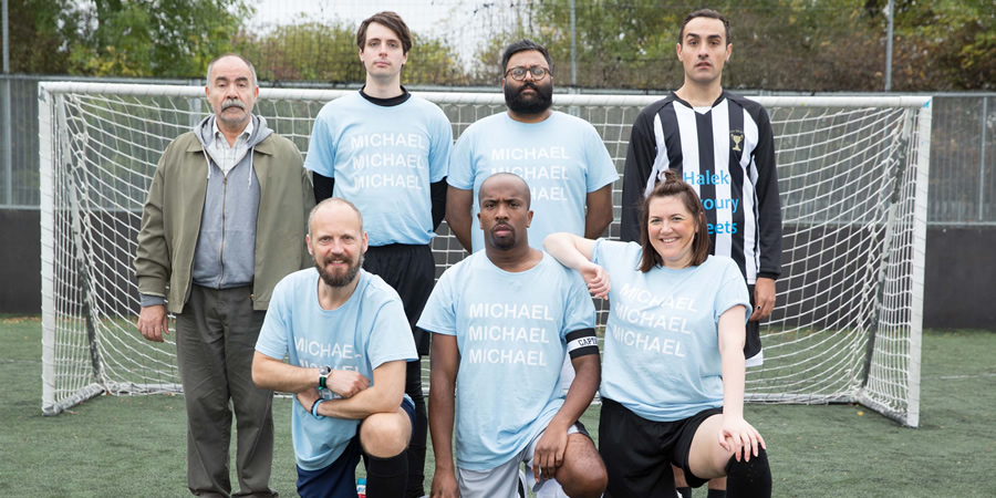 Stath Lets Flats. Image shows from L to R: Vasos (Christos Stergioglou), Marcus (Alex Beckett), Al (Alastair Roberts), Dean (Kiell Smith-Bynoe), Phil Khoo (Sunil Patel), Carole (Katy Wix), Stath (Jamie Demetriou). Copyright: Roughcut Television. Stath Lets Flats. Image shows from L to R: Vasos (Christos Stergioglou), Marcus (Alex Beckett), Al (Alastair Roberts), Dean (Kiell Smith-Bynoe), Phil Khoo (Sunil Patel), Carole (Katy Wix), Stath (Jamie Demetriou). Copyright: Roughcut Television.