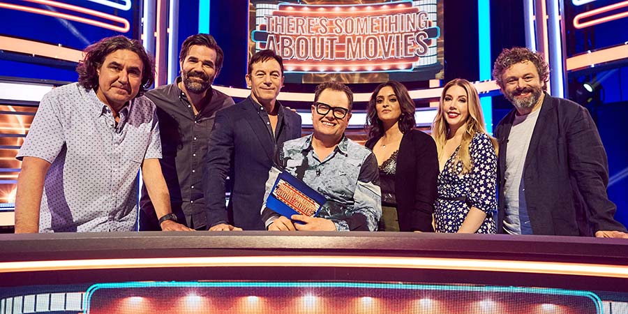 There's Something About Movies. Image shows from L to R: Micky Flanagan, Rob Delaney, Jason Isaacs, Alan Carr, Mandeep Dhillon, Katherine Ryan, Michael Sheen. Copyright: CPL Productions. There's Something About Movies. Image shows from L to R: Micky Flanagan, Rob Delaney, Jason Isaacs, Alan Carr, Mandeep Dhillon, Katherine Ryan, Michael Sheen. Copyright: CPL Productions.