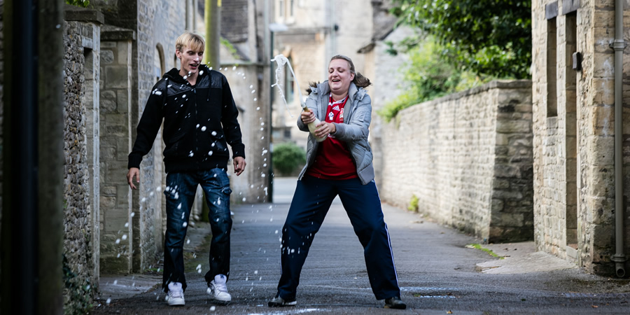 This Country. Image shows from L to R: Lee 'Kurtan' Mucklowe (Charlie Cooper), Kerry Mucklowe (Daisy May Cooper). Copyright: BBC. This Country. Image shows from L to R: Lee 'Kurtan' Mucklowe (Charlie Cooper), Kerry Mucklowe (Daisy May Cooper). Copyright: BBC.