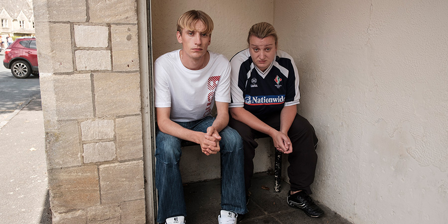 This Country. Image shows from L to R: Lee 'Kurtan' Mucklowe (Charlie Cooper), Kerry Mucklowe (Daisy May Cooper). This Country. Image shows from L to R: Lee 'Kurtan' Mucklowe (Charlie Cooper), Kerry Mucklowe (Daisy May Cooper).