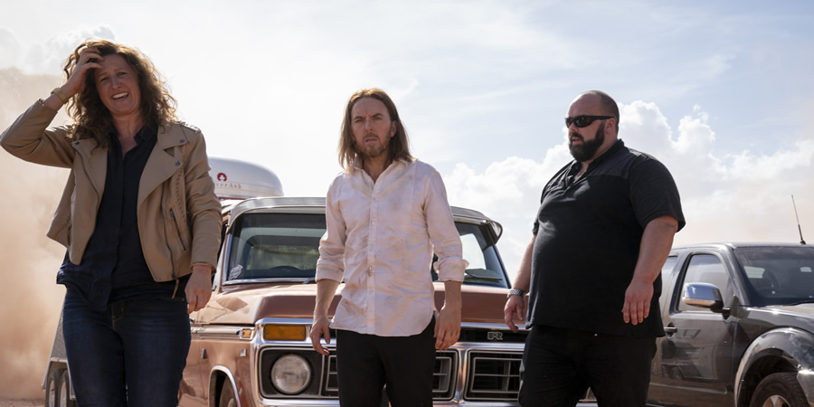 Upright. Image shows from L to R: Esme (Kate Box), Lucky Flynn (Tim Minchin), Big Man (Michael McCall). Upright. Image shows from L to R: Esme (Kate Box), Lucky Flynn (Tim Minchin), Big Man (Michael McCall).
