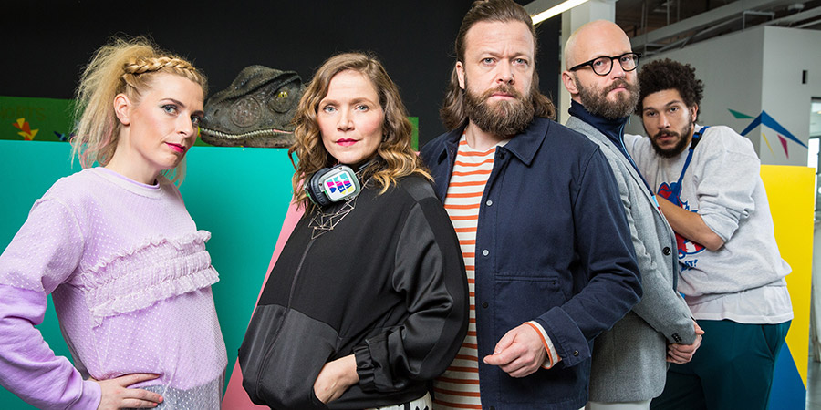 W1A. Image shows from L to R: Coco Lomax (Sara Pascoe), Siobhan Sharpe (Jessica Hynes), Jens Smit (Kåre Conradi), Barney Lumsden (Alex Beckett), Karl Marx (Joel Fry). Copyright: BBC. W1A. Image shows from L to R: Coco Lomax (Sara Pascoe), Siobhan Sharpe (Jessica Hynes), Jens Smit (Kåre Conradi), Barney Lumsden (Alex Beckett), Karl Marx (Joel Fry). Copyright: BBC.