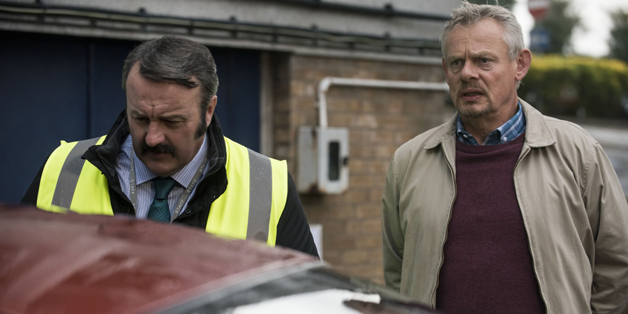 Warren. Image shows from L to R: Bob (Mike Bubbins), Warren Thompson (Martin Clunes). Copyright: Hat Trick Productions. Warren. Image shows from L to R: Bob (Mike Bubbins), Warren Thompson (Martin Clunes). Copyright: Hat Trick Productions.