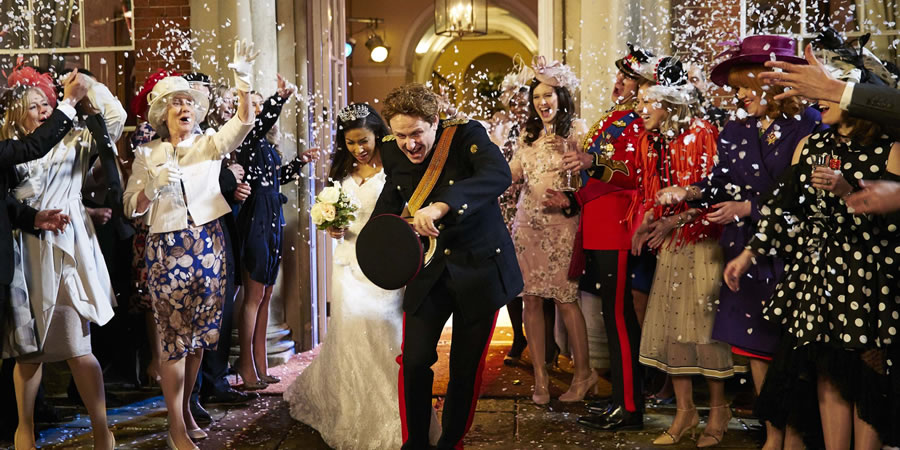 The Windsors. Image shows from L to R: Meghan Markle (Kathryn Drysdale), Harry (Richard Goulding). Copyright: Noho Film and TV. The Windsors. Image shows from L to R: Meghan Markle (Kathryn Drysdale), Harry (Richard Goulding). Copyright: Noho Film and TV.