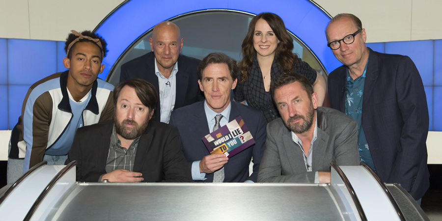 Would I Lie To You?. Image shows from L to R: Jordan Stephens, David Mitchell, Claude Littner, Rob Brydon, Cariad Lloyd, Lee Mack, Adrian Edmondson. Copyright: Zeppotron. Would I Lie To You?. Image shows from L to R: Jordan Stephens, David Mitchell, Claude Littner, Rob Brydon, Cariad Lloyd, Lee Mack, Adrian Edmondson. Copyright: Zeppotron.
