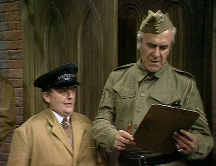 Dad's Army. Image shows from L to R: Man from Pickfords (Don Estelle), Sergeant Wilson (John Le Mesurier). Copyright: BBC. Dad's Army. Image shows from L to R: Man from Pickfords (Don Estelle), Sergeant Wilson (John Le Mesurier). Copyright: BBC.