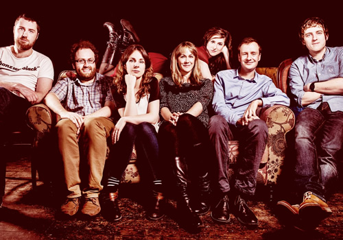 Here Be Dragons. Image shows from L to R: Lloyd Langford, Gareth Gwynn, Cariad Lloyd, Sian Harries, Nadia Kamil, Benjamin Partridge, Elis James. Copyright: John Stanley Productions. Here Be Dragons. Image shows from L to R: Lloyd Langford, Gareth Gwynn, Cariad Lloyd, Sian Harries, Nadia Kamil, Benjamin Partridge, Elis James. Copyright: John Stanley Productions.