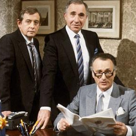 Yes Minister. Image shows from L to R: Bernard Woolley (Derek Fowlds), Sir Humphrey Appleby (Nigel Hawthorne), James Hacker (Paul Eddington). Copyright: BBC. Yes Minister. Image shows from L to R: Bernard Woolley (Derek Fowlds), Sir Humphrey Appleby (Nigel Hawthorne), James Hacker (Paul Eddington). Copyright: BBC.