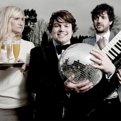 Wedding Band: A Comedy by Charlie Baker. Image shows from L to R: Sam Battersea, Charlie Baker, Spencer Jones. Wedding Band: A Comedy by Charlie Baker. Image shows from L to R: Sam Battersea, Charlie Baker, Spencer Jones.