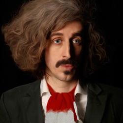 Tom Wrigglesworth: Utterly at Odds with the Universe. Tom Wrigglesworth. Copyright: Top Dog Productions. Tom Wrigglesworth: Utterly at Odds with the Universe. Tom Wrigglesworth. Copyright: Top Dog Productions.