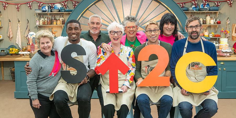 The Great Celebrity Bake Off for Stand Up To Cancer 2020. Image shows from L to R: Sandi Toksvig, Ovie Soko, Paul Hollywood, Jenny Eclair, Prue Leith, Russell Howard, Noel Fielding, Louis Theroux. Copyright: Channel 4 Television Corporation. The Great Celebrity Bake Off for Stand Up To Cancer 2020. Image shows from L to R: Sandi Toksvig, Ovie Soko, Paul Hollywood, Jenny Eclair, Prue Leith, Russell Howard, Noel Fielding, Louis Theroux. Copyright: Channel 4 Television Corporation.