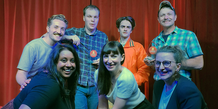 Image shows from L to R: Benjamin Lovell, Suchandrika Chakrabarti, Bennet Kavanagh, Liz Guterbock, Luke Rollason, Brandon Burke, Felicity Ward. Image shows from L to R: Benjamin Lovell, Suchandrika Chakrabarti, Bennet Kavanagh, Liz Guterbock, Luke Rollason, Brandon Burke, Felicity Ward.
