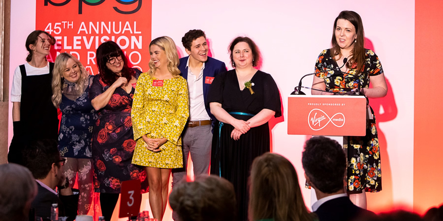 Derry Girls win at the BPG Awards 2019. Image shows from L to R: Louisa Harland, Nicola Coughlan, Liz Lewin, Saoirse-Monica Jackson, Dylan Llewellyn, Siobhán McSweeney, Lisa McGee. Copyright: BPG / Virgin Media. Derry Girls win at the BPG Awards 2019. Image shows from L to R: Louisa Harland, Nicola Coughlan, Liz Lewin, Saoirse-Monica Jackson, Dylan Llewellyn, Siobhán McSweeney, Lisa McGee. Copyright: BPG / Virgin Media.