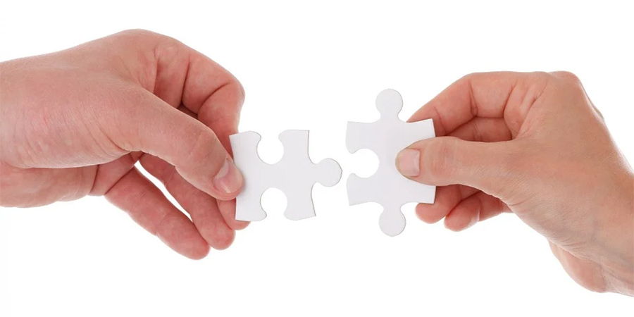 Generic picture of people holding jigsaw pieces. Generic picture of people holding jigsaw pieces.