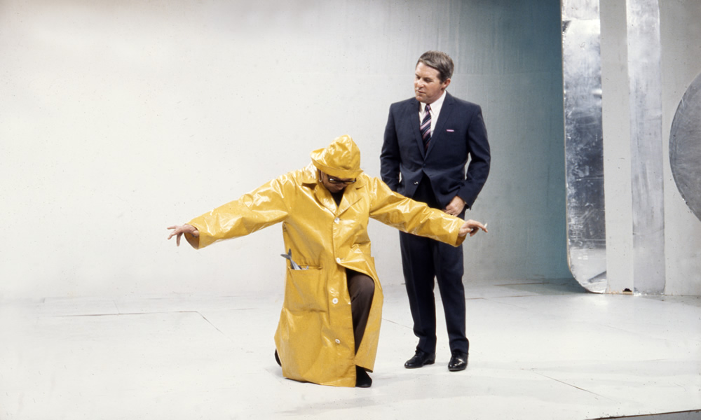 Eric Morecambe in yellow souwester and Ernie Wise on set, 02/09/1968. Image shows from L to R: Eric Morecambe, Ernie Wise. Copyright: BBC History. Eric Morecambe in yellow souwester and Ernie Wise on set, 02/09/1968. Image shows from L to R: Eric Morecambe, Ernie Wise. Copyright: BBC History.