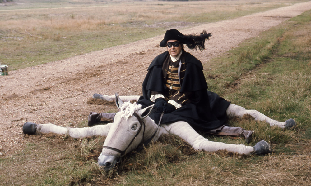 Eric Morecambe as Dick Turpin on collapsed fake horse, 20/10/1975. Eric Morecambe. Copyright: BBC History. Eric Morecambe as Dick Turpin on collapsed fake horse, 20/10/1975. Eric Morecambe. Copyright: BBC History.