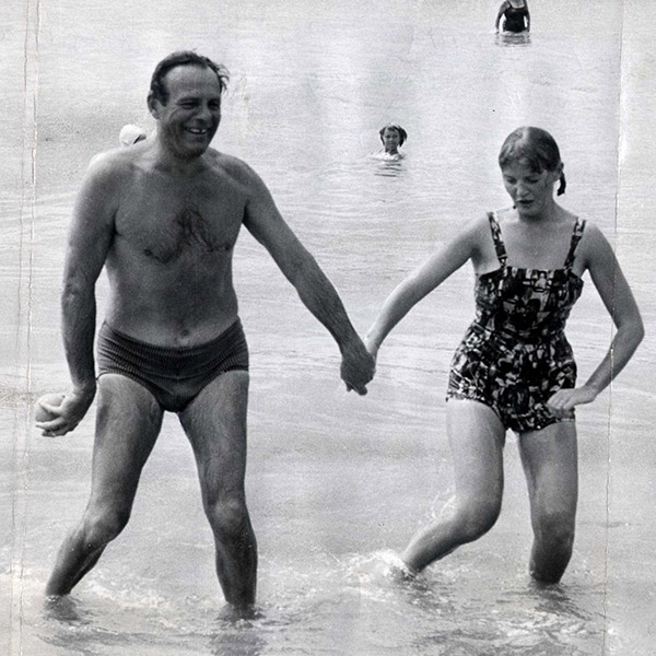 Terry-Thomas and his wife, Belinda, padding in the sea. Terry-Thomas and his wife, Belinda, padding in the sea.