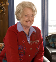 The Café. Mary Ellis (June Watson). Copyright: Jellylegs. The Café. Mary Ellis (June Watson). Copyright: Jellylegs.