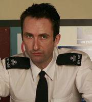 The Visit. Officer Mark Bamford (Darren Tighe). Copyright: BBC. The Visit. Officer Mark Bamford (Darren Tighe). Copyright: BBC.