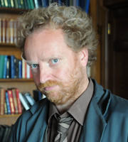 Trinity. Professor Linus Cooper (Paul Hunter). Copyright: Roughcut Television. Trinity. Professor Linus Cooper (Paul Hunter). Copyright: Roughcut Television.