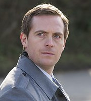 The Wrong Mans. Smoke (Stephen Campbell Moore). Copyright: BBC / Hulu. The Wrong Mans. Smoke (Stephen Campbell Moore). Copyright: BBC / Hulu.